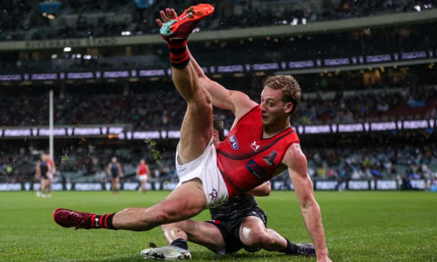 Darcy Parish is tackled by Port Adelaide’s Zak Butters during Essendon’s most recent AFL defeat, on Sunday at Adelaide Oval.