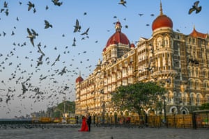 Mumbai, IndiaA couple poses for photographs in front of the Taj Mahal hotel
