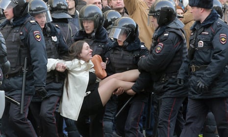 Russian riot police detain an anti-corruption demonstrator in central Moscow last month.