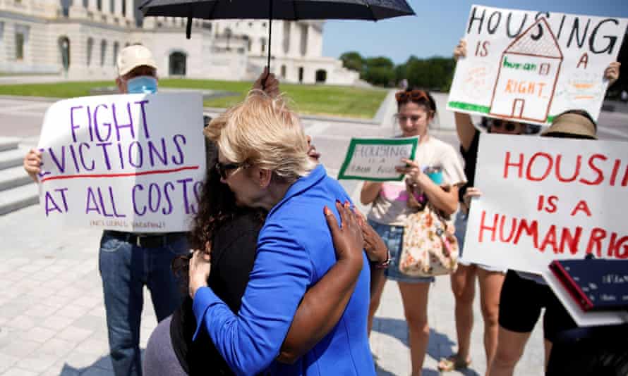 Representative Cori Bush and Senator Elizabeth Warren embrace on the steps of the US Capitol.