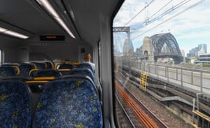 One man sits on a Sydney train service as it is about to cross the Harbour Bridge