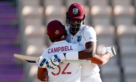 The West Indies capain Jason Holder celebrates with John Campbell after the winning runs were scored.