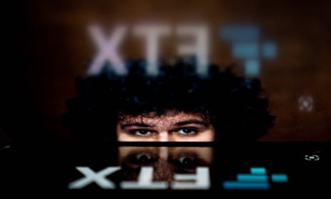 Cryptocurrency FTX’s logo reflected in an image of former chief executive Samuel Bankman-Fried.