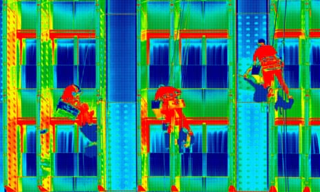 Infrared thermovision image three climbers washing office windows