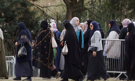 Relatives and other people arrive to attend the burial ceremony of the victims of the mosque attacks, at the Memorial Park Cemetery in Christchurch.