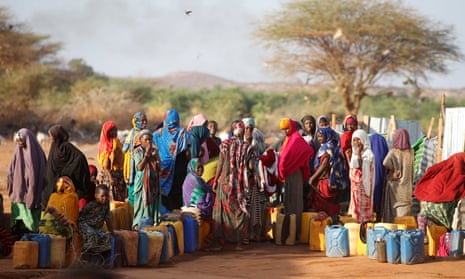 Women collect water at the New Kabasa camp for internally displaced people in northern Somalia, 2018