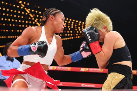 Alycia Baumgardner lands a left hand on Bo Mi Re Shin during Friday’s fight.