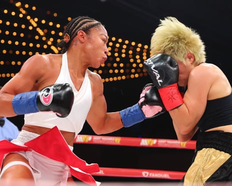 Alycia Baumgardner lands a left hand on Bo Mi Re Shin during Friday’s fight.