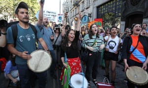 Protesters join a demonstration organised by climate change activists from Extinction Rebellion outside the Brazilian embassy in central London on 23 August.