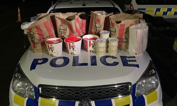 KFC chicken and fries found by New Zealand police when they arrested two men trying to cross into Auckland despite city's strict lockdown.