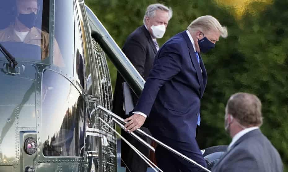 Donald Trump arrives at Walter Reed National Military Medical Center in Maryland, with Mark Meadows, on 2 October 2020.