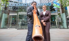 Adrian Burragubba and Murrawah Johnson outside Standard Chartered after meeting bank representatives.