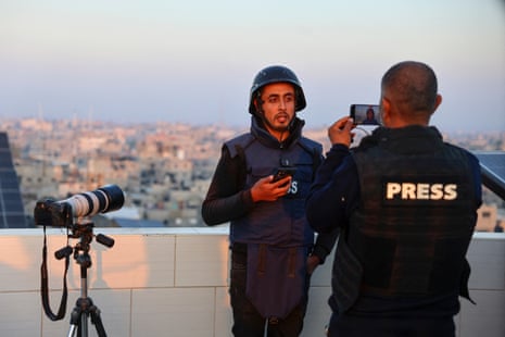 Hani al-Shaer, a Palestinian journalist, broadcasts via a mobile phone from Rafah on 27 December