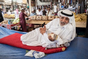 A money changer in a market in downtown Jeddah