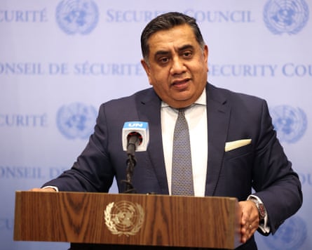 An older South Asian man standing at a lectern with a backdrop saying ‘security council’