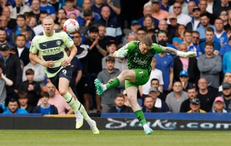 Everton v Manchester City: Premier League – live | Premier League 5 Jordan Pickford clears under pressure from Erling Haaland.