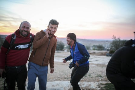 Awdah with his friends Basel Adra and Hamdan Ballal in the village of Susya during a photography workshop in January 2023.