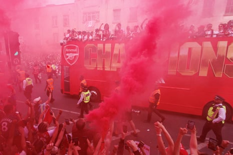 Arsenal fans watching rthe parade.