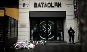 A police officer stands guard in front of the Bataclan concert venue during a ceremony marking the fifth anniversary of the terror attacks in Paris, France