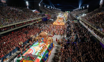 Revellers participate in the carnival parade at the Sambadrome in Rio de Janeiro on Sunday.