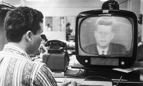A Cuban exile in Miami watches President Kennedy address the nation in 1962