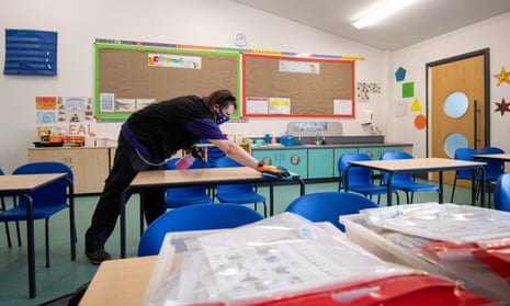 Tables being disinfected at Queen’s Hill Primary School in Costessey, near Norwich, 24 August 2020. 