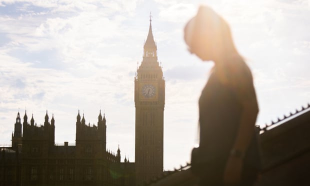 People walk near Westminster Bridge, central London