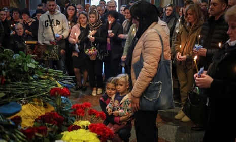 Wife Liudmyla and daughters Anna and Sofiia of Borovyk, at his memorial service in central Kyiv, Ukraine.