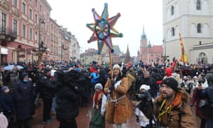 An Epiphany procession in Warsaw, Poland on 6 January. One man holds a colourful star.