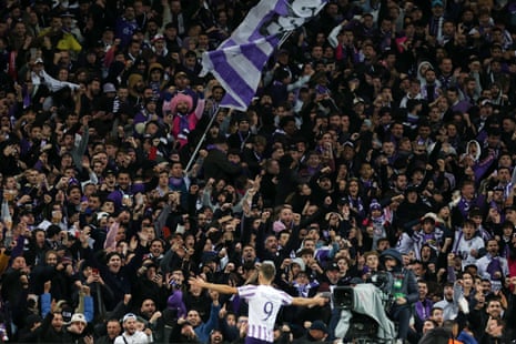 Fans of Toulouse celebrate after Thijs Dallinga doubled their lead over Liverpool.