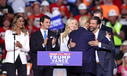 Donald Trump greets his family members