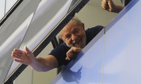 Brazil’s former President Luiz Inacio Lula da Silva waves to supporters from a window of the Metal Workers Union headquarters in São Bernardo do Campo, Brazil, before he was later jailed for corruption on the same day.