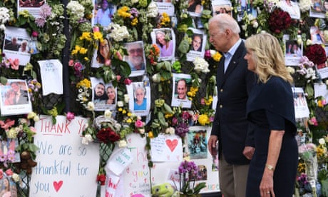 Joe and Jill Biden at a memorial wall near the condo site in Surfside. Biden said: ‘The families are realistic. They know that the chances are, as each day goes by, diminished.’