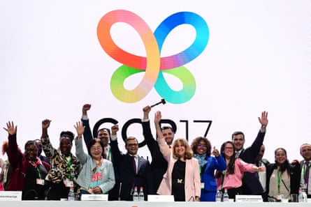 Cop17 attenders during the closing session wave.