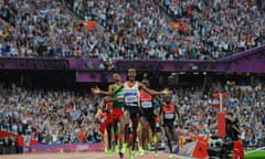 Mo Farah reacts as he crosses the finishing line to win the men’s 5,000m at the London 2012 Olympics
