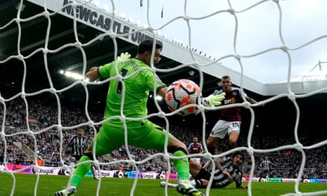 Sandro Tonali of Newcastle United (right) scores his team's first goal of the match.