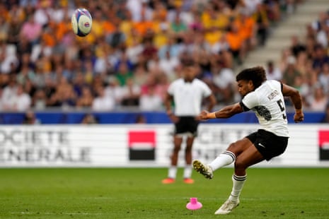 Fiji's scrum-half Simione Kuruvoli succesfully kicks a penalty.