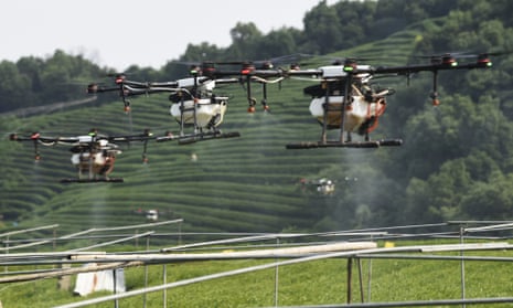 Drones spraying pesticides in China are an example of their cost-saving commercial usages. 