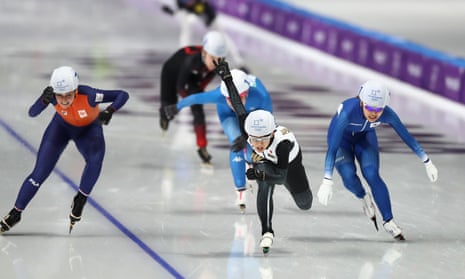 Nana Takagi of Japan races to the finish line ahead of Bo-Reum Kim of Korea and Irene Schouten of the Netherlands to win the gold medal in the women’s speed skating mass start final.