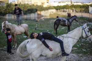Children play outside their home in the Jabalia camp in Gaza City