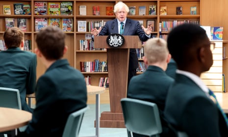 On the shelves behind Boris Johnson, copies of How It Works magazine can also be seen.