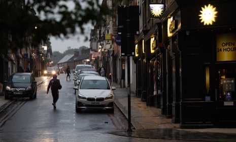 A pedestrian passes a Cashino casino and slot machine outlet, operated by Merkur in Luton