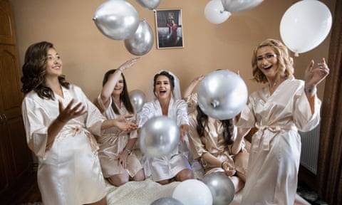 Jesica Monica Bura poses with her bridesmaids in her parents’ house in the village of Cămărzana