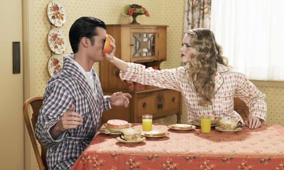 married couple arguing at breakfast table