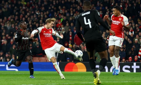 Arsenal’s Martin Odegaard scores their fifth goal against Lens.