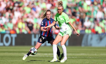 Keira Walsh challenges Wolfsburg's Jill Roord during Barcelona's Women's Champions League final win.