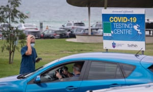 People wait for Covid-19 tests at a testing site in Sydney, Australia as infections hit 1m.