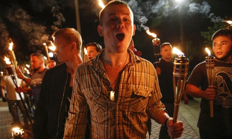 White nationalist groups march with torches through the University of Virginia campus in Charlottesville, Virginia, on 11 August 2017.