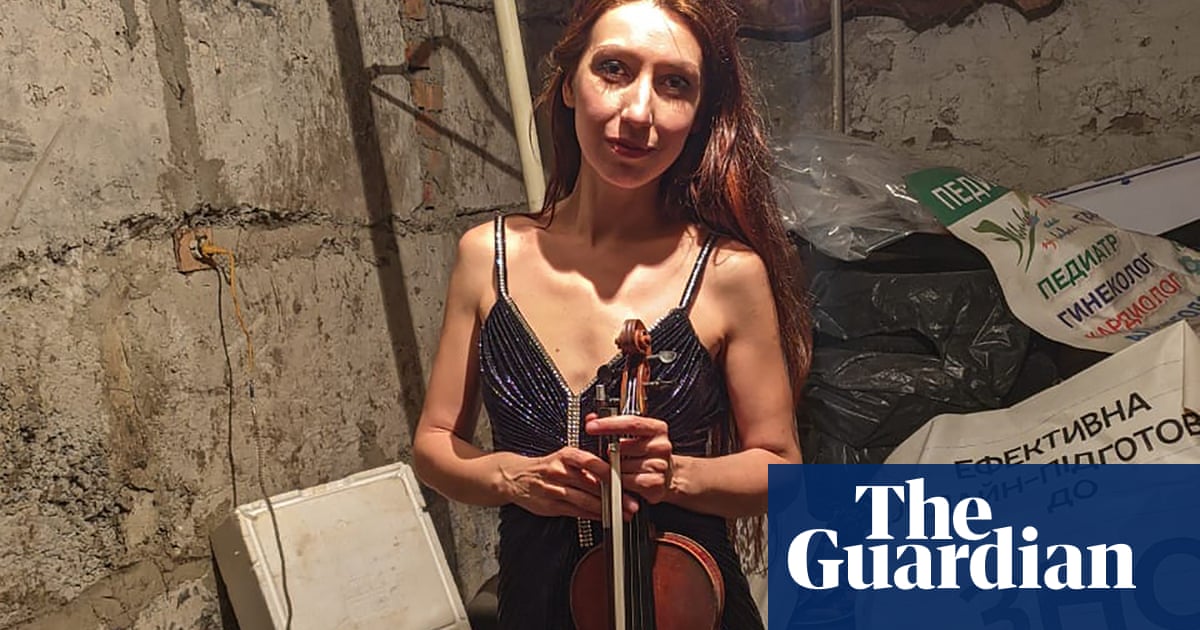 Violinist Vera plays for group huddled in basement while bombs fall