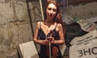Violinist Vera plays for group huddled in basement while bombs fall